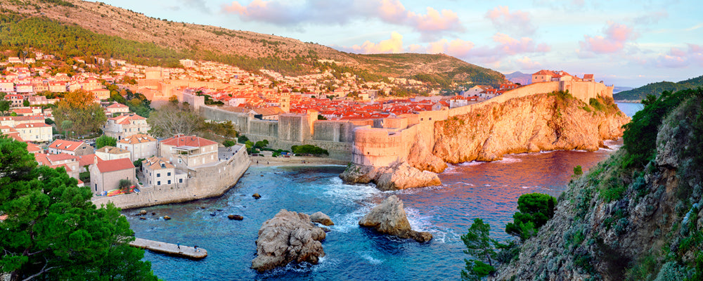 Sunset light on the city walls and rooftops of Dubrovnik, Croatia - fine art photography print by Adam Gormley