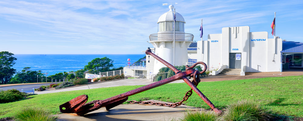Rusted anchor in front of the Eden Killer Whale Museum, New South Wales - fine art photography print by Adam Gormley