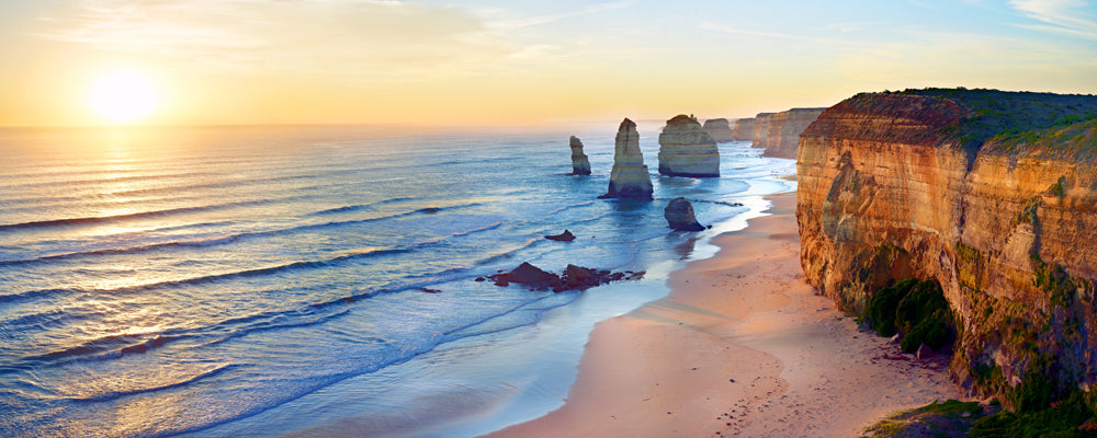 Low sun over the Twelve Apostles limestone stacks and cliffs, Great Ocean Road, Victoria - fine art photography print by Adam Gormley