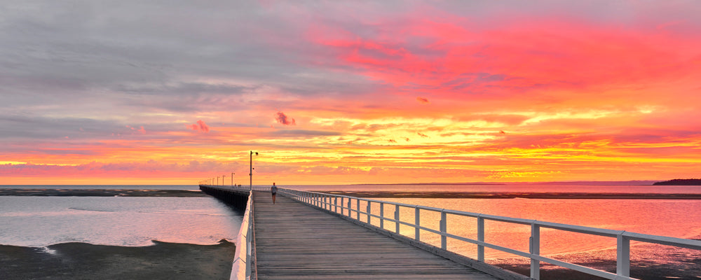 Blazing red sunrise over Urangan Pier, Hervey Bay, Queensland - fine art photography print by Adam Gormley