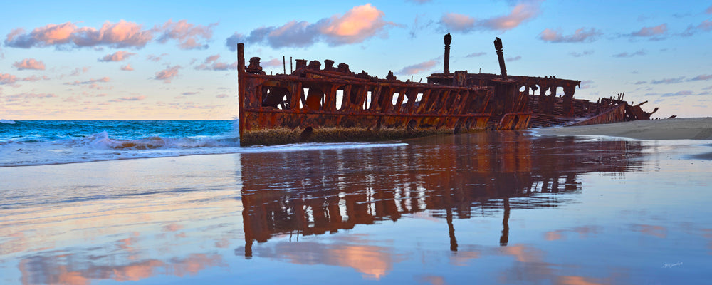 Maheno shipwreck reflected in wet sand under pink clouds, K'gari (Fraser Island), Queensland - fine art photography print by Adam Gormley