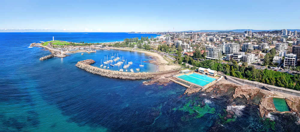 Aerial view of Wollongong Harbour and ocean pools, New South Wales - fine art photography print by Adam Gormley