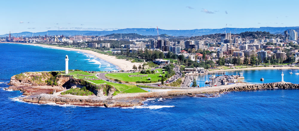 Wollongong Head Lighthouse on Flagstaff Point with the city behind, New South Wales - fine art photography print by Adam Gormley