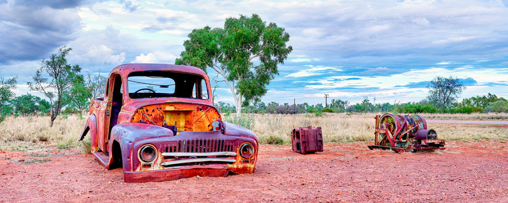 Old rusted pickup truck on red dirt in the Northern Territory outback - fine art photography print by Adam Gormley