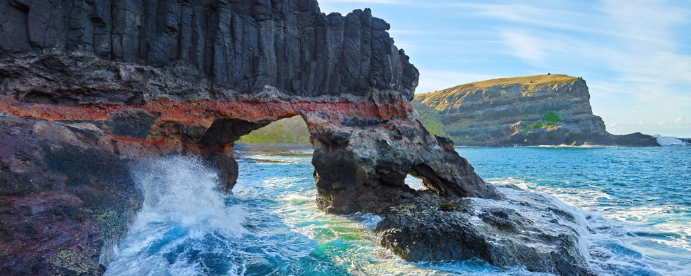Waves crashing through a basalt rock arch at Bushrangers Bay, Victoria - fine art photography print by Adam Gormley