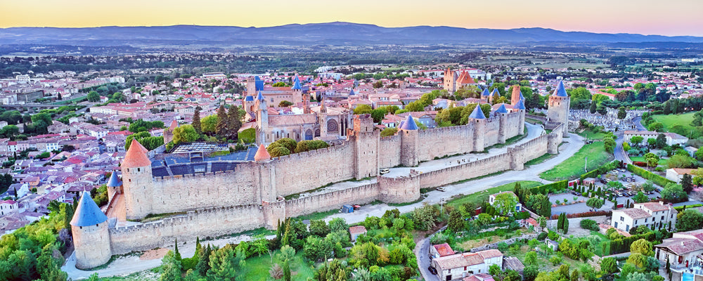 Walls and towers of La Cité de Carcassonne under a pastel sky, France - fine art photography print by Adam Gormley