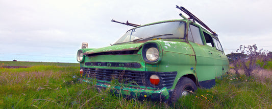 Old green van rusting in long grass near Coleraine, Victoria - fine art photography print by Adam Gormley