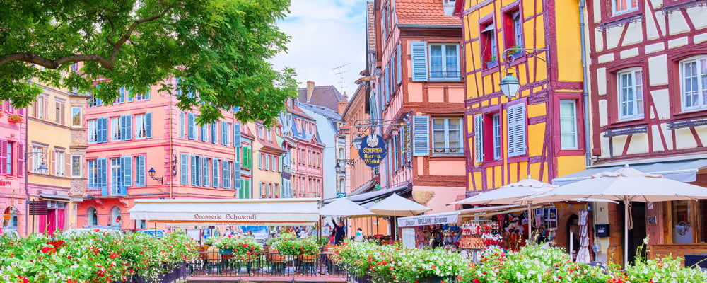 Colourful half-timbered buildings and flowers in Colmar old town, Alsace, France - fine art photography print by Adam Gormley