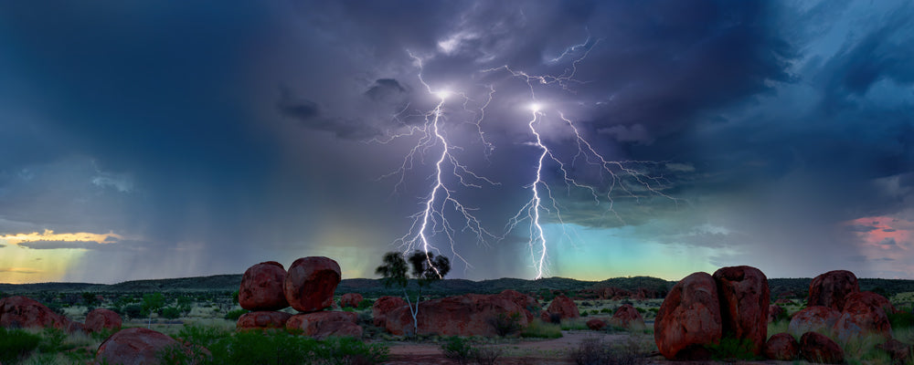 Lightning striking over the boulders of Karlu Karlu (Devils Marbles), Northern Territory - fine art photography print by Adam Gormley