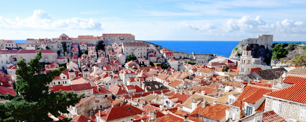 Terracotta rooftops and bell tower of Dubrovnik Old Town, Croatia - fine art photography print by Adam Gormley