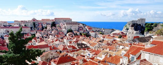 Terracotta rooftops and bell tower of Dubrovnik Old Town, Croatia - fine art photography print by Adam Gormley