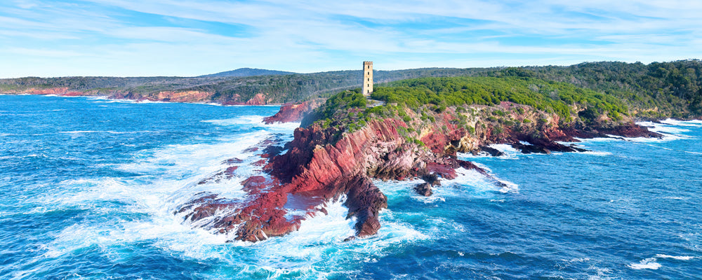 Boyds Tower on red cliffs above a rough sea, Ben Boyd National Park, New South Wales - fine art photography print by Adam Gormley