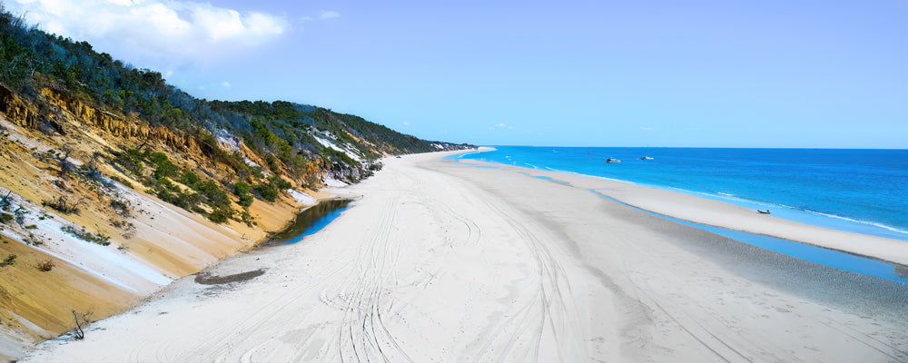Coloured sand cliffs and empty beach at Bowarrady, K'gari (Fraser Island), Queensland - fine art photography print by Adam Gormley