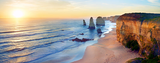 Low sun over the Twelve Apostles limestone stacks and cliffs, Great Ocean Road, Victoria - fine art photography print by Adam Gormley