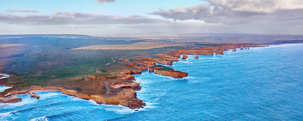 Aerial view of limestone headlands and sea stacks on the Shipwreck Coast, Victoria - fine art photography print by Adam Gormley