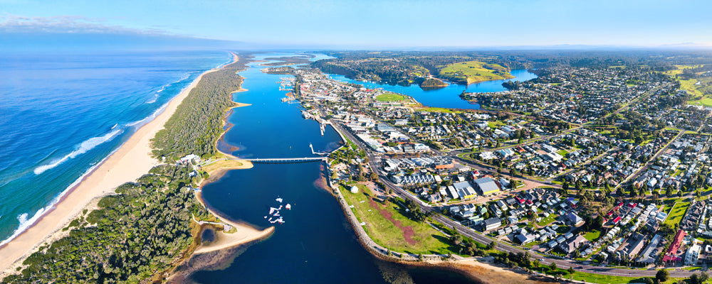 Aerial view of Lakes Entrance and the footbridge to Ninety Mile Beach, Victoria - fine art photography print by Adam Gormley
