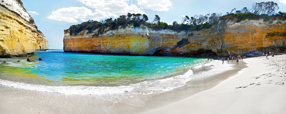White sand beach and clear water below golden cliffs at Loch Ard Gorge, Victoria - fine art photography print by Adam Gormley