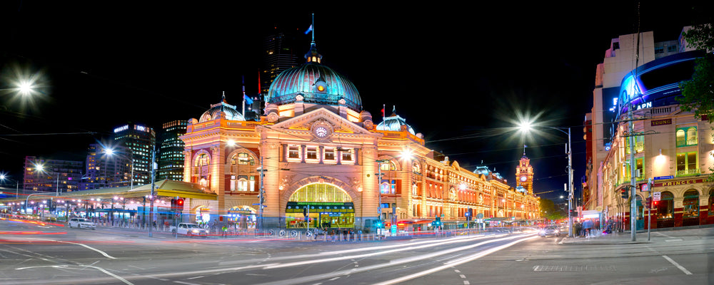 Flinders Street Station lit up at night with light trails, Melbourne, Victoria - fine art photography print by Adam Gormley