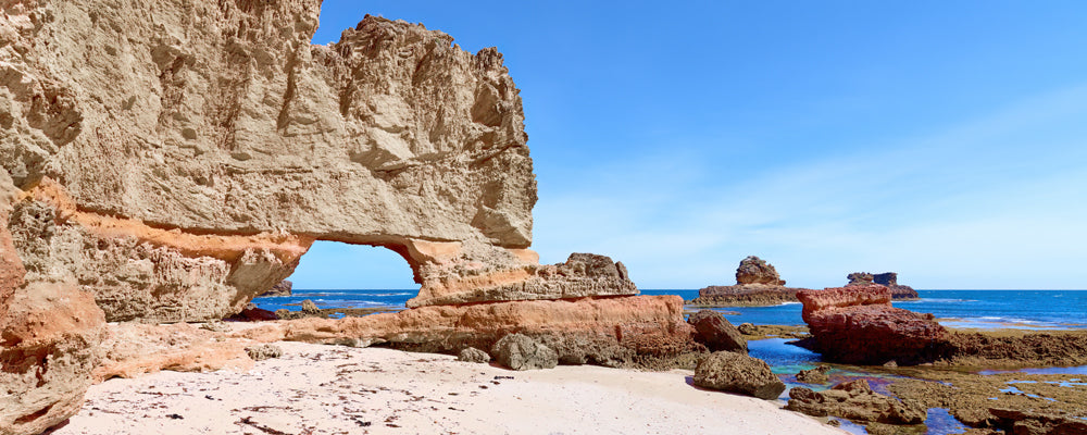 Golden sandstone arch on an ocean beach, Mornington Peninsula, Victoria - fine art photography print by Adam Gormley