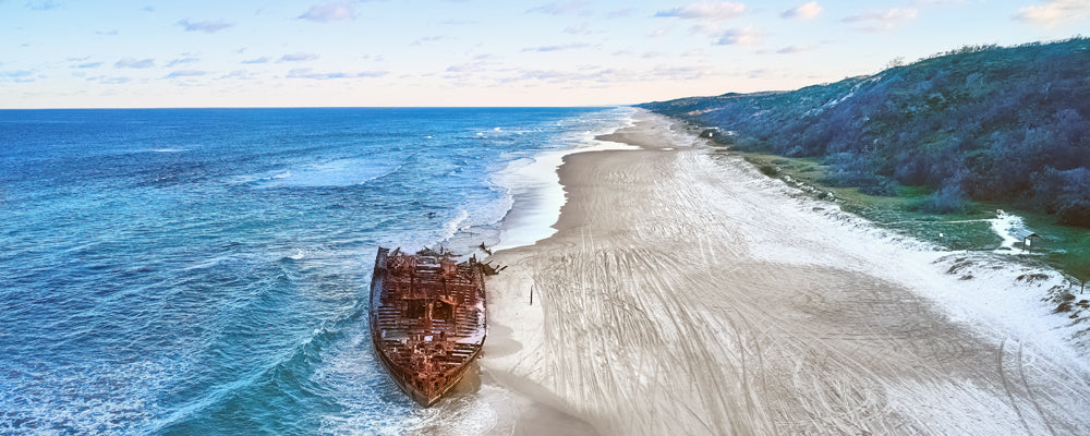 Aerial view of the Maheno shipwreck on 75 Mile Beach, K'gari (Fraser Island), Queensland - fine art photography print by Adam Gormley