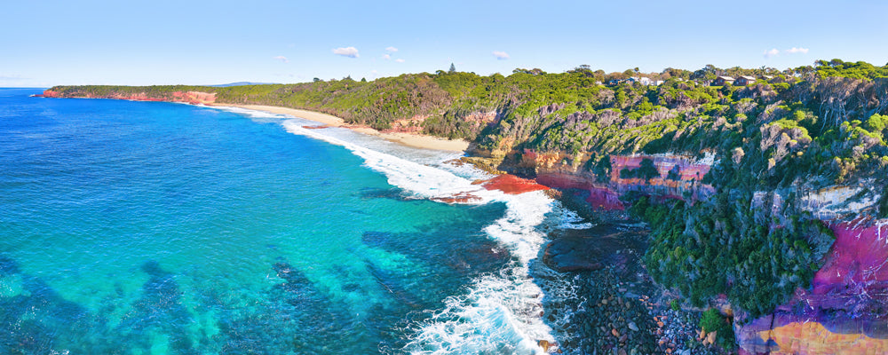 Pink and red cliffs above turquoise water at Merimbula, New South Wales - fine art photography print by Adam Gormley