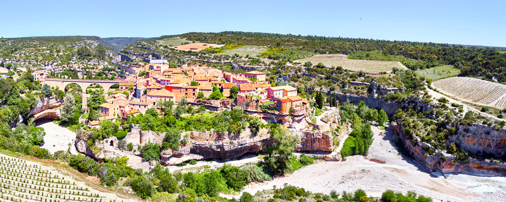 Aerial view of the village of Minerve between limestone gorges, France - fine art photography print by Adam Gormley