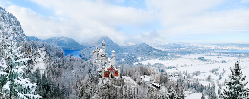 Aerial view of Neuschwanstein Castle and the snowy landscape, Bavaria, Germany - fine art photography print by Adam Gormley