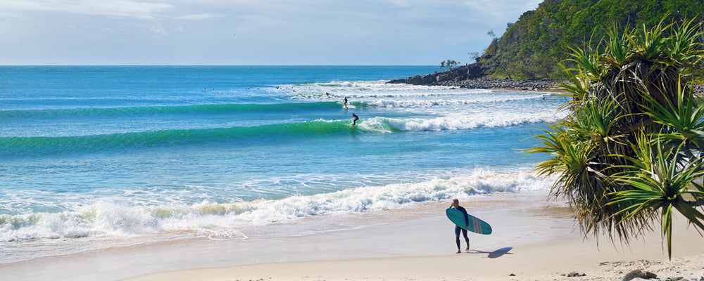 Surfers and turquoise waves at Noosa, Sunshine Coast, Queensland - fine art photography print by Adam Gormley