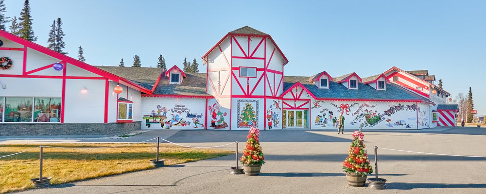 Red and white Christmas-themed building in North Pole, Alaska - fine art photography print by Adam Gormley