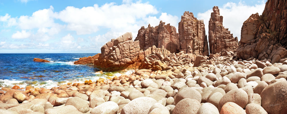 Pink granite pinnacles above a boulder beach at Cape Woolamai, Phillip Island, Victoria - fine art photography print by Adam Gormley