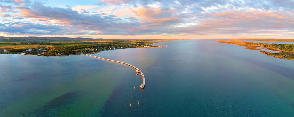 Aerial view of the Port Welshpool Long Jetty at sunset, Victoria - fine art photography print by Adam Gormley