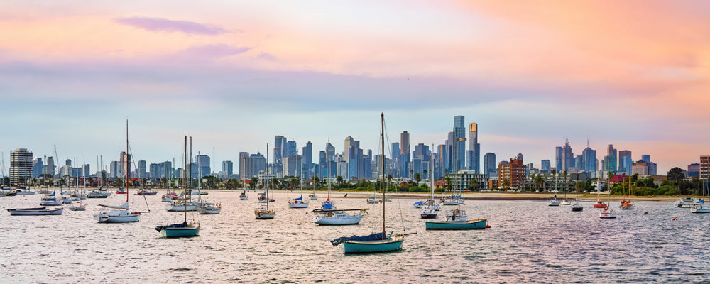 Yachts moored off St Kilda with the Melbourne skyline at sunset, Victoria - fine art photography print by Adam Gormley