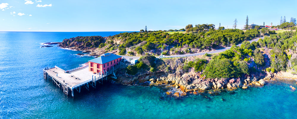 Historic Tathra Wharf reaching into clear blue water, New South Wales - fine art photography print by Adam Gormley