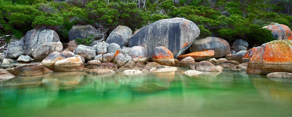 Granite boulders beside still green water, Wilsons Promontory, Victoria - fine art photography print by Adam Gormley